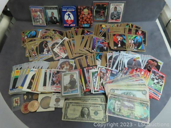 A lot containing sports cards and foreign currency is up for auction at IowaUnclaimedProperty.org